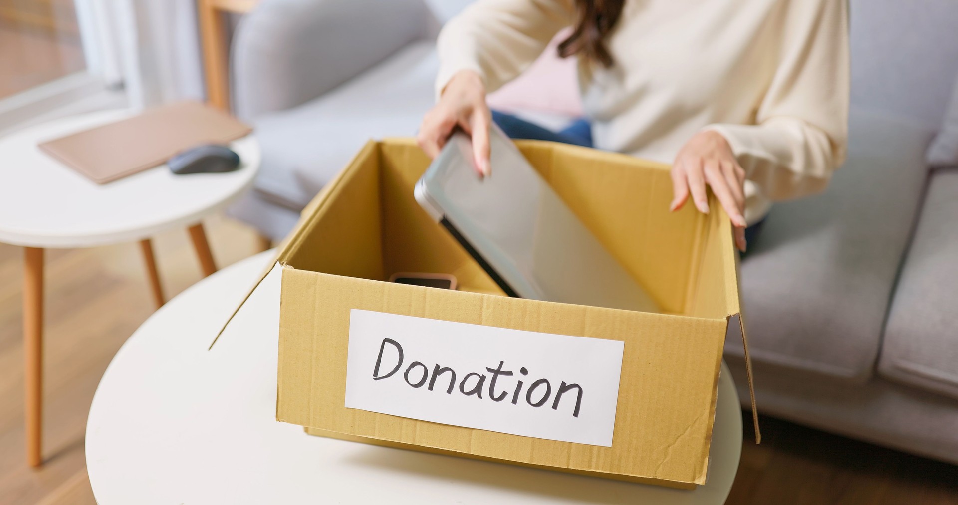 woman pack Donation electronics
